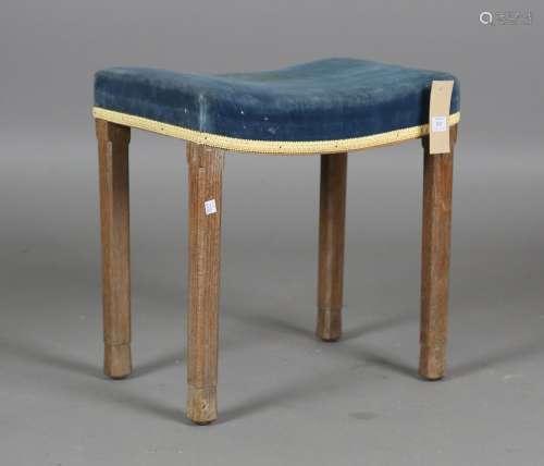 An Elizabeth II limed oak coronation stool with blue velvet ...