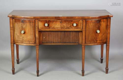 A Regency mahogany and ebony lined inlaid bowfront sideboard...