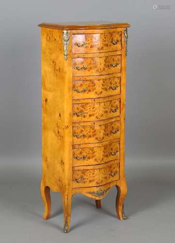 A modern maple and gilt metal mounted serpentine front chest...