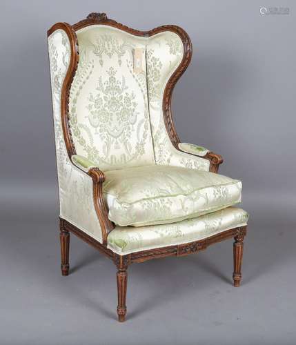 An early 20th century French Louis XVI style walnut showfram...