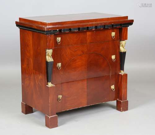 A late 20th century Empire style mahogany chest of drawers w...