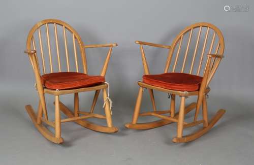 A pair of mid-20th century Ercol Windsor rocking armchairs, ...