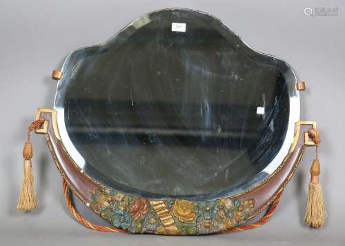 An Art Deco shaped wall mirror with a painted and carved flo...