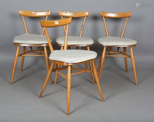A set of four mid-20th century Ercol beech and elm stacking ...