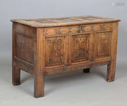 A late 17th/early 18th century panelled oak coffer, the frie...