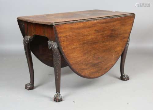 A George III Irish mahogany oval drop-flap dining table, the...