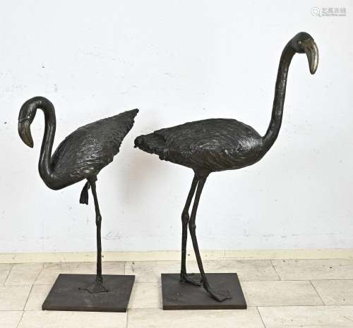 Two bronze flamingos