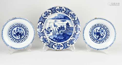 Three 18th century Delft plates Ø 23 - 31 cm.