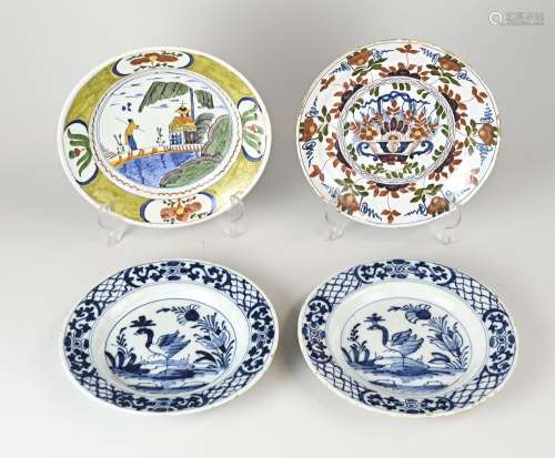 Four antique Delft plates Ø 23 - 24 cm.