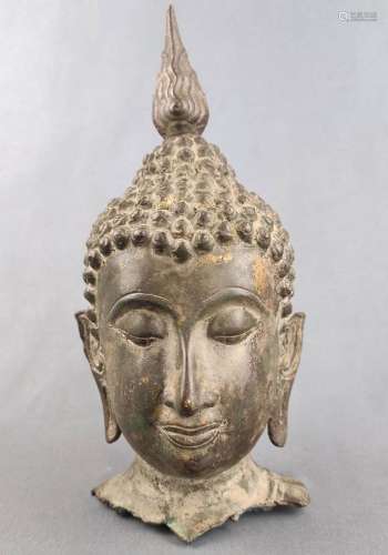 Head of a Buddha figure, probably Thailand, lowered gaze and...