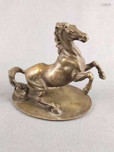 Horse sculpture on oval plate, rearing horse with blowing ma...