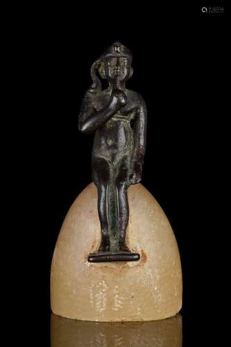 EGYPTIAN BRONZE SEATED HARPOCRATES ON ALABASTER BASE