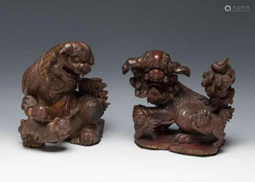 Two Foo dogs, Qing dynasty. China, 18th century. Carved, pol...