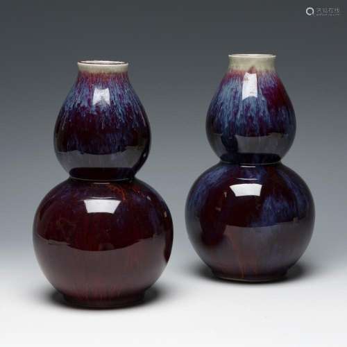 Pair of "sang de boeuf" double gourd vases, Qing d...