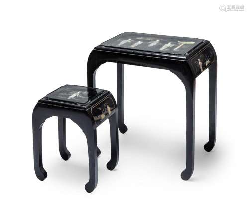 Pair of Chinese tables, 20th century. Lacquered wood with in...