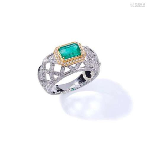 An emerald and diamond dress ring