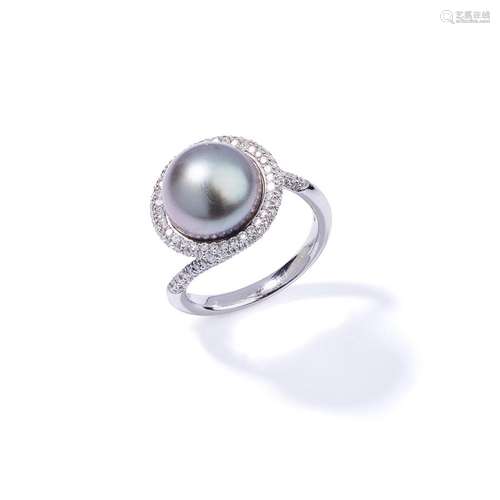 A cultured pearl and diamond ring