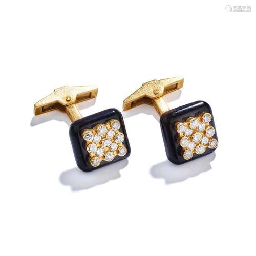 A pair of onyx and diamond cufflinks