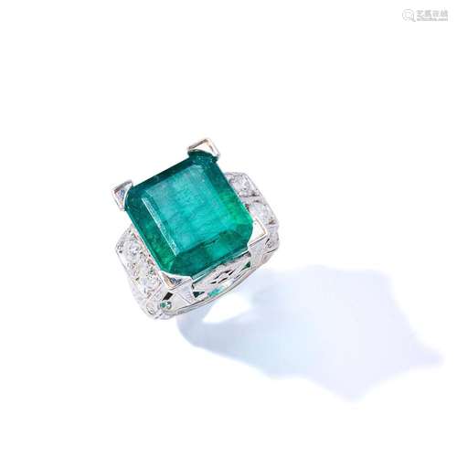 An emerald and diamond dress ring