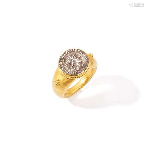 An antique coin dress ring