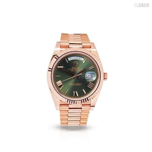 Rolex: A rose gold wristwatch