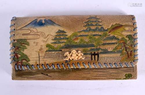 AN EARLY 20TH CENTURY JAPANESE MEIJI PERIOD EMBOSSED LEATHER...