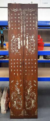 A PAIR OF LARGE 19TH CENTURY CHINESE HONGMU PANELS decorated...