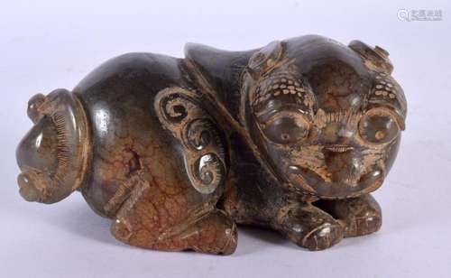 A CHINESE CARVED JADE FIGURE OF A BUDDHISTIC BEAST 20th Cent...