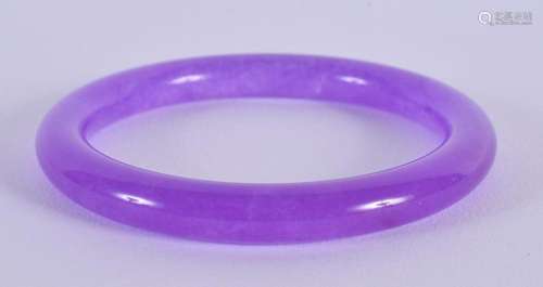 A CHINESE CARVED LAVENDER JADE BANGLE 20th Century. 7.5 cm d...