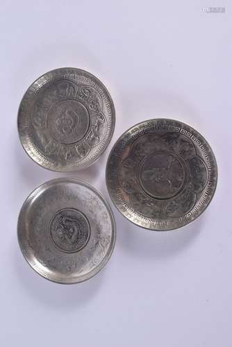 THREE CHINESE WHITE METAL COIN DISHES 20th Century. 330 gram...