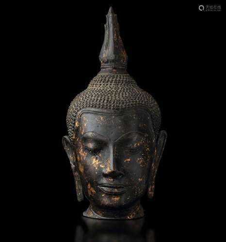 A partly gilt bronze Buddha head, Thailand, 1700s