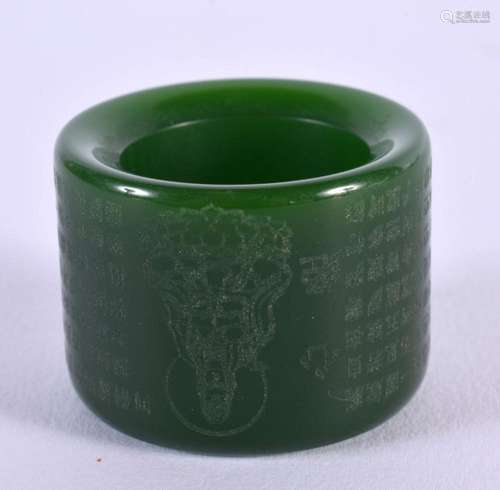 A CHINESE JADE ARCHERS RING 20th Century. 2.25 cm wide.