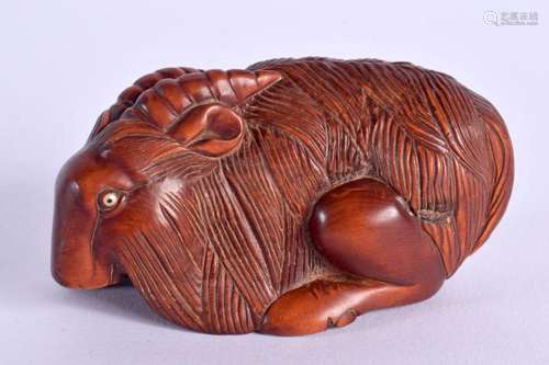 A JAPANESE CARVED BOXWOOD RAM OKIMONO. 7 cm x 3.5 cm.