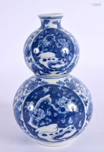 A CHINESE BLUE AND WHITE DOUBLE GOURD VASE 20th Century. 14 ...