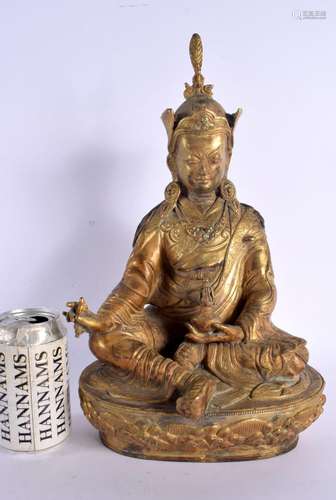 A LARGE 19TH CENTURY CHINESE TIBETAN BRONZE FIGURE OF A BUDD...