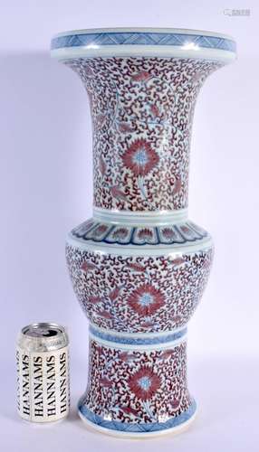 A LARGE 19TH CENTURY CHINESE IRON RED BLUE AND WHITE GU FORM...