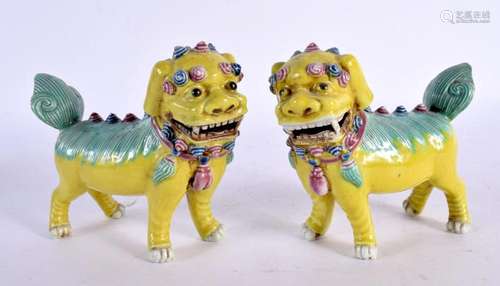 A PAIR OF 19TH CENTURY CHINESE YELLOW GLAZED PORCELAIN FIGUR...