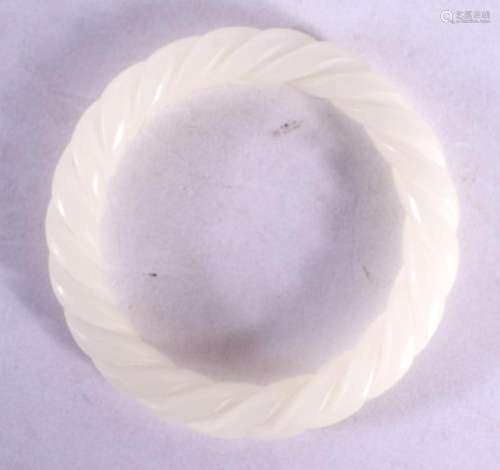 A CHINESE CARVED WHITE JADE TWIST BANGLE 20th Century. 6 cm ...