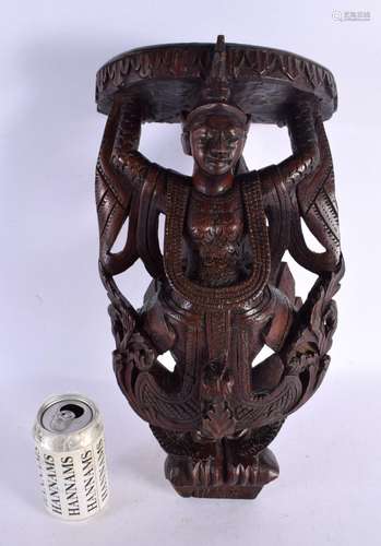 A 19TH CENTURY BURMESE SOUTH EAST ASIAN WOOD PEDESTAL SHELF....