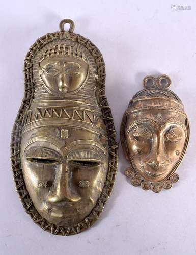 TWO TRIBAL BRONZE MASKS. 21 cm x 10.5 cm. (2)