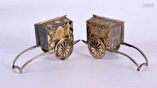 A PAIR OF JAPANESE TAISHO PERIOD SILVER MIXED METAL RICKSHAW...