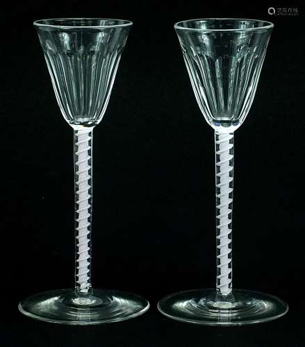 Pair of antique wine glasses with opaque twist stems and fac...