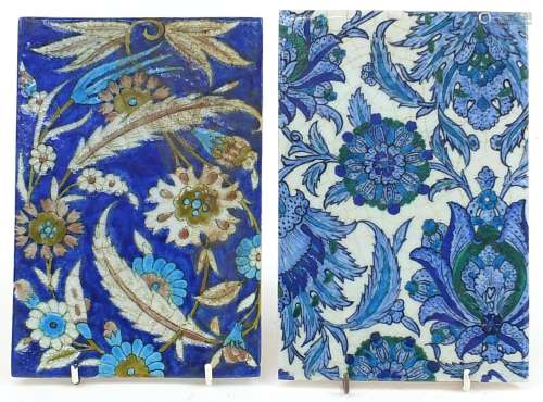 Two Turkish Iznik pottery tiles hand painted with leaves and...