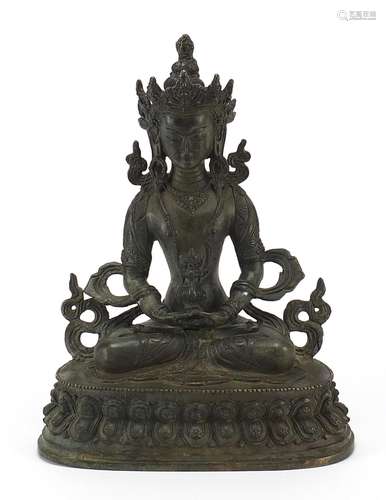 Chino Tibetan patinated bronze figure of seated Buddha, 29.5...