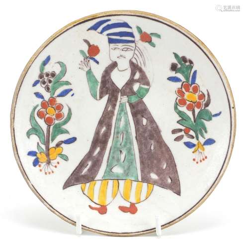 Turkish Kutahya pottery dish hand painted with a figure, 14....