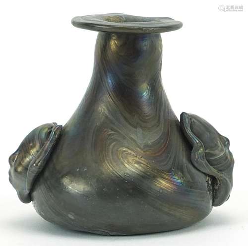 Roman iridescent glass vase with figural handles, 7.5cm high
