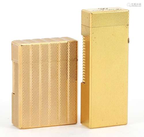 Two gold plated engine turned pocket lighters comprising Dun...