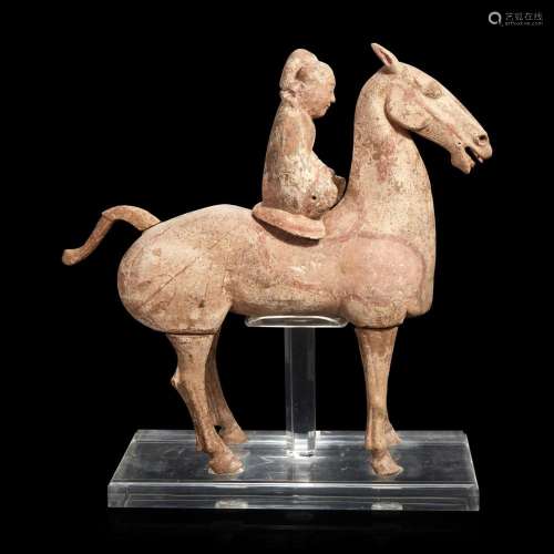 A Chinese large painted pottery figure of a horse and rider ...