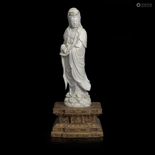 A Chinese blanc de Chine figure of Guanyin, with Japanese gi...