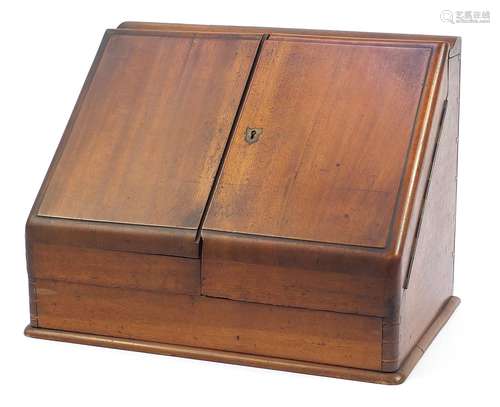 Victorian mahogany slope front stationary cabinet with perpe...